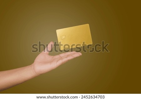 male hand holding floating gold Bank credit Card mockup template on isolated background