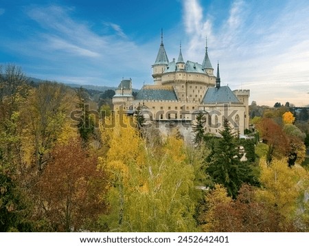 Aerial View of Bojnice Castle in a Neo-Gothic Romantic style - UNESCO Heritage, Slovakia. Panoramic picture, orange-yellow-green colors, Autumn.