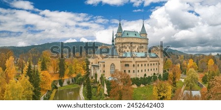 Panoramic Aerial View of Bojnice Castle in Vivid Fall Colors, blue sky - Ideal for Poster, UNESCO Heritage, Slovakia