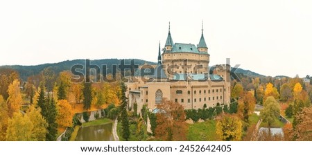 Ideal for Poster: Panoramic View of Bojnice Castle in Vivid Fall Colors against white background, UNESCO Heritage, Slovakia.