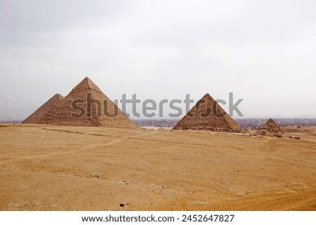 The Giza Pyramid Complex in Giza, Egypt, also called the Giza Necropolis. It was built during the Fourth Dynasty of the Old Kingdom Royalty-Free Stock Photo #2452647827