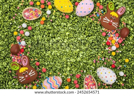 Color Easter egg sweets on desk background
