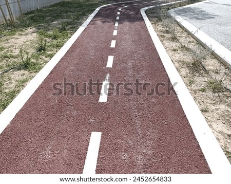 Modern bike path, road for bicycles, turns right Royalty-Free Stock Photo #2452654833