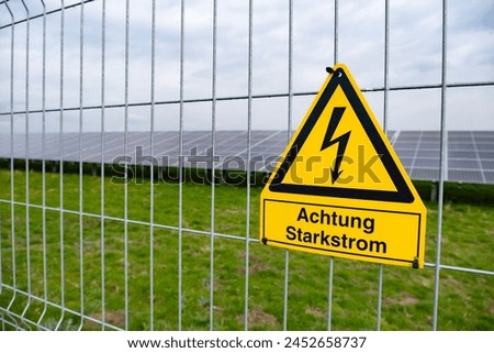 yellow warning sign Solar farms, capturing solar energy through photovoltaic panels, which contain solar cells convert sunlight into electricity, Sustainable future