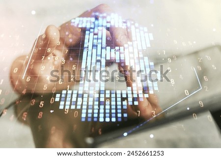 Creative Bitcoin concept with finger presses on a digital tablet on background. Double exposure