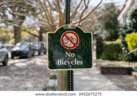 A close-up of a sign reading "No Bicycles"