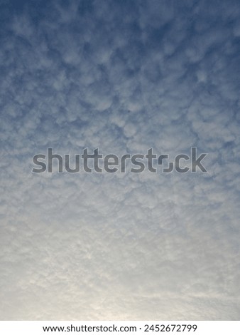 Cumulus cloud. Cloudscape. Blue sky scenery. Sunshine. Fine weather. View village sky in the morning. Meteorology. White clouds. New Portrait. Light. Bright. From dark to light. Latest Background Royalty-Free Stock Photo #2452672799