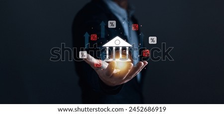 Interest rate, interest burden, inflation, debt rate, financial percentage concept, businessman's hand with bank icon and financial percentage Showing the increase in central bank.
