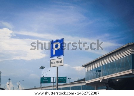 Parking sign for Bus or Truck at the airport terminal with blue sky on the background