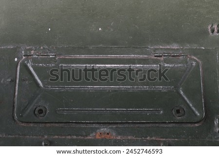 Technical niche with a lid with holes for screws. Tank hatch. Closed window.