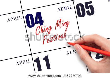 April 4. Hand writing text Ching Ming Festival on calendar date. Save the date. Holiday. Important date.