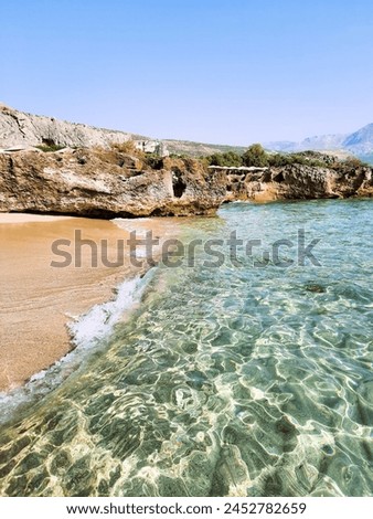 The beautiful sandy beach of Falassarna on the western side of the Greek island of Crete. Beautiful clear clear water. Very popular with tourists. Royalty-Free Stock Photo #2452782659