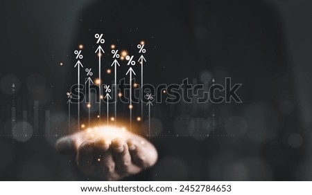 Interest rate and dividend concept. Businessman hand with rising arrow and percentage icon. Business finance and money concept, Investment growth, Return on stocks and mutual funds, profitability,