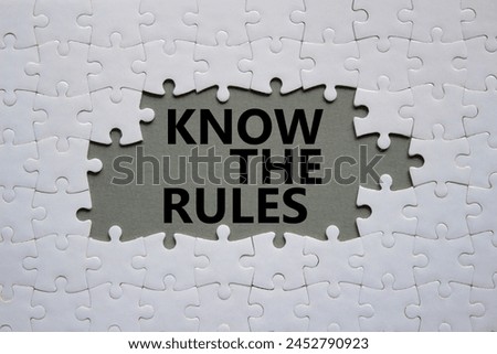 Know the rules symbol. Concept words Know the rules on white puzzle. Beautiful grey background. Business and Know the rules concept. Copy space.