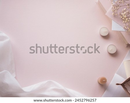 Pale pink flat lay top view, woman's cute desk frame