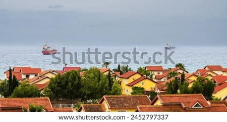 complex of houses with red roofs against the backdrop of the sea in Northern Cyprus 12