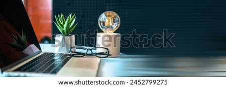 Office table, laptop, glasses on the table, business concept, stock photo