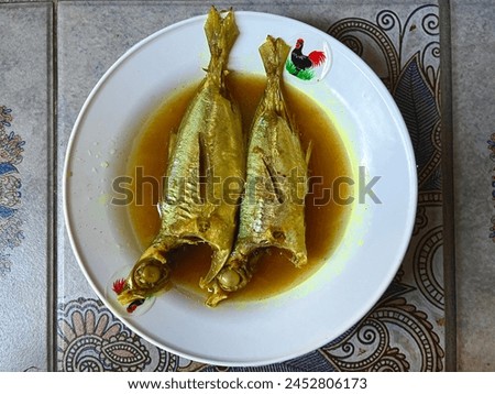 Yellow fish soup or yellow spice fish soup, traditional Indonesian food. use turmeric and salt.