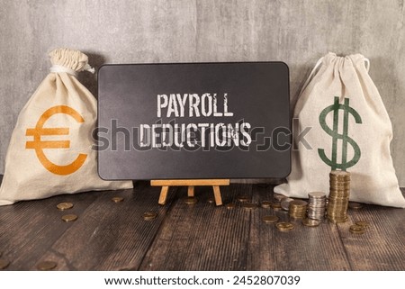 Selective focus. Calculator,pencil and banknotes with the word Payroll Deduction on world map background