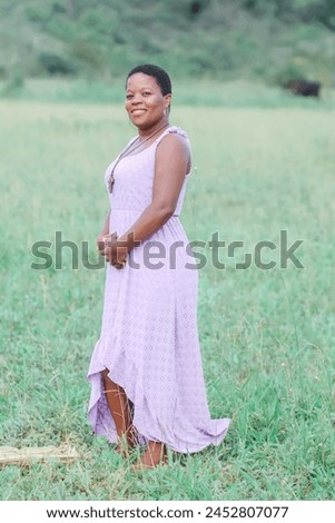 Black woman, from the Northeast representing the Northeast of Brazil. she is in a natural environment, contemplating nature and giving thanks. Royalty-Free Stock Photo #2452807077