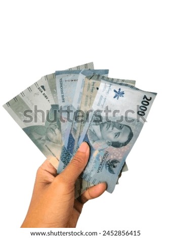Cash payment concept. Indonesian rupiah currency (Rp. 2.000 Dua Ribu Rupiah), Two thousand Indonesian rupiah currency.