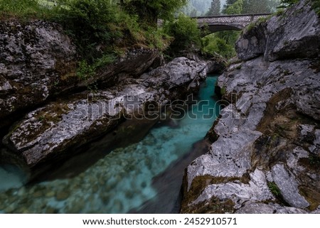 Early morning at Mala korita (Small Gorge) on the emerald Soca river with an old stone arched bridge, Triglav National Park, Julian Alps, Slovenia