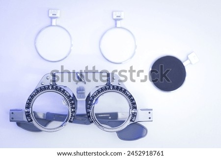 Optometric frame measurement. Trial frame for eye test  Royalty-Free Stock Photo #2452918761