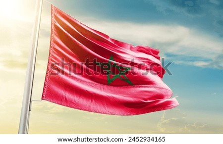 Morocco national flag waving in beautiful sky.