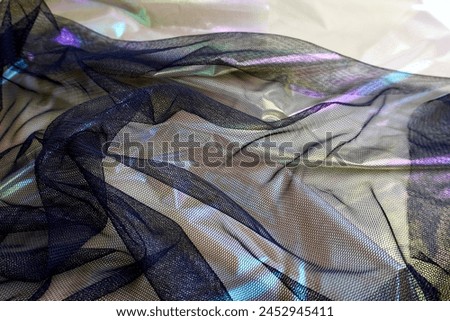 Thin black clothing fabric sheet on shimmering fabric material cloth photography for social media, prints, or website wallpaper and backdrop isolated on horizontal ratio background.