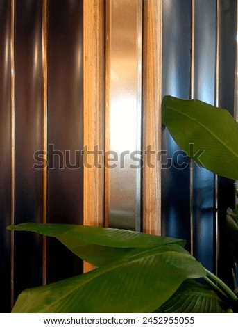 
The restaurant panel with plants in front of it
