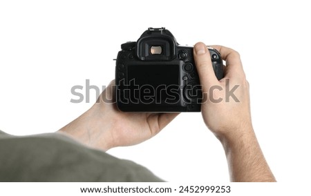 Photographer holding modern camera on white background, closeup