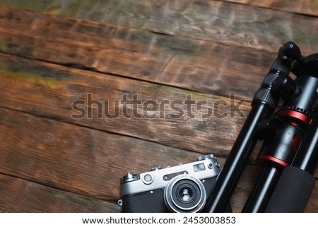 Photo studio equipment concept top view background with copy space. Photostudio led constant light sources and different light modifiers on the wooden table background. Royalty-Free Stock Photo #2453003853
