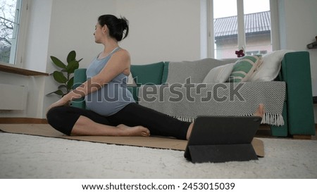Late Stage Pregnancy Back Stretch Routine - 30s Pregnant Woman Prioritizing Wellbeing with Gentle Exercises at Home, Enhancing Body Health and Comfort