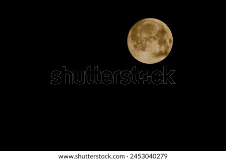 Full moon with black sky, golden moon