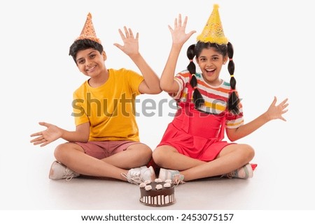 Happy boy and girl celebrating birthday together