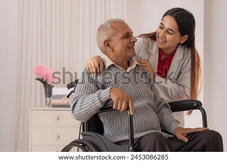 Nurse taking care of the senior patient sitting on wheel chair Royalty-Free Stock Photo #2453086285