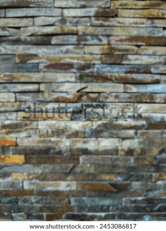 Blurred granite brick wall texture for background