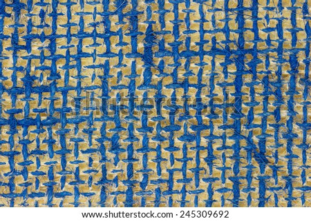 Closeup background picture of burlap fabric painted navy blue color