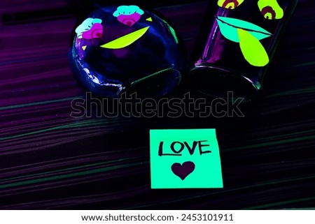 Concept Multi color male and couple bottle with hand written word love in sticky notes.