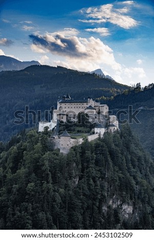 Werfen Castle, located in Austria's Salzburger Land, stands as a towering historical monument against a backdrop of spectacular alpine scenery. 