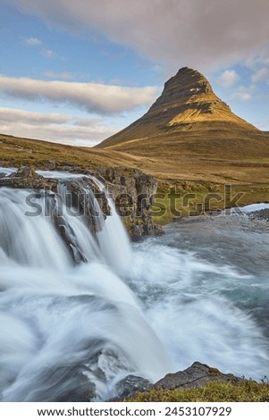One of Iceland's iconic landscapes, Mount Kirkjufell and Kirkjufellsfoss Falls, near Grundarfjordur, Snaefellsnes peninsula, Iceland, Polar Regions