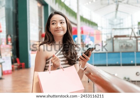 woman using smartphone for online shopping at home. Hand holding mobile phone with payment detail page display and credit card, stay home, technology, electronic commerce, internet, market place