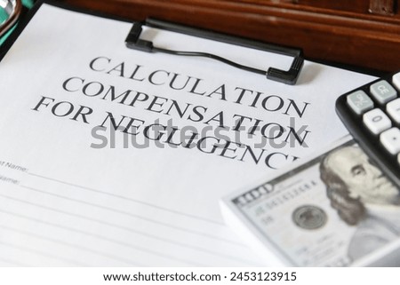 Legal document titled 'Calculation Compensation for Negligence' with a gavel and calculator, symbolizing judicial proceedings. Royalty-Free Stock Photo #2453123915