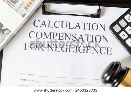 Legal document titled 'Calculation Compensation for Negligence' with a gavel and calculator, symbolizing judicial proceedings. Royalty-Free Stock Photo #2453123931