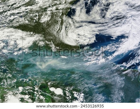 Smoke from Fires in Canada. A ribbon of smoke snakes across western Canada in this truecolor image from August 2, 2010. Elements of this image furnished by NASA.