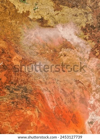 Dust storm in central Australia. Dust storm in central Australia. Elements of this image furnished by NASA. Royalty-Free Stock Photo #2453127739