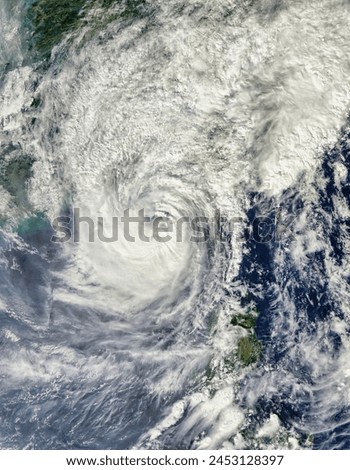 Typhoon Megi 15W over China. Typhoon Megi 15W over China. Elements of this image furnished by NASA. Royalty-Free Stock Photo #2453128397