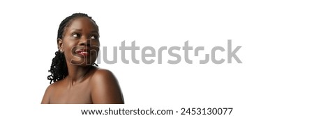 Inherent beauty of African woman. Well-kept skin symbolizing harmonious balance of health, wellness, and self-care. Concept of natural beauty, skin and body care, cosmetology, cosmetics. Banner Royalty-Free Stock Photo #2453130077