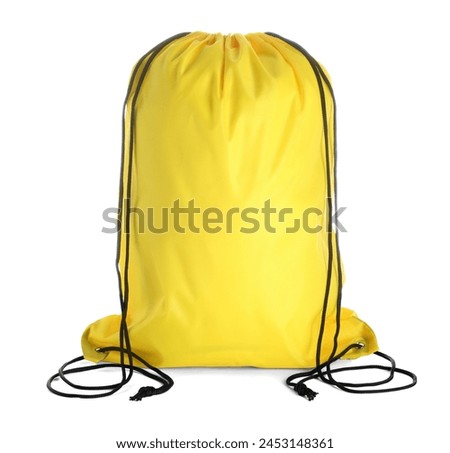 One yellow drawstring bag isolated on white Royalty-Free Stock Photo #2453148361
