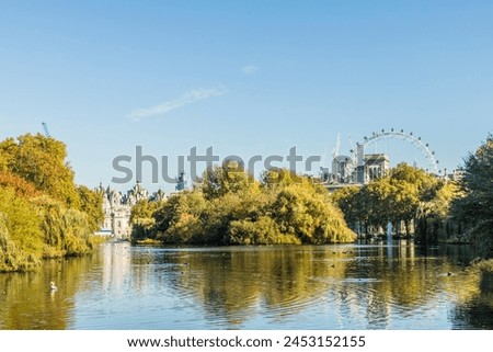 A view of St. James's Park lake and the London Eye in the background in St. James's Park, London, England, United Kingdom, Europe